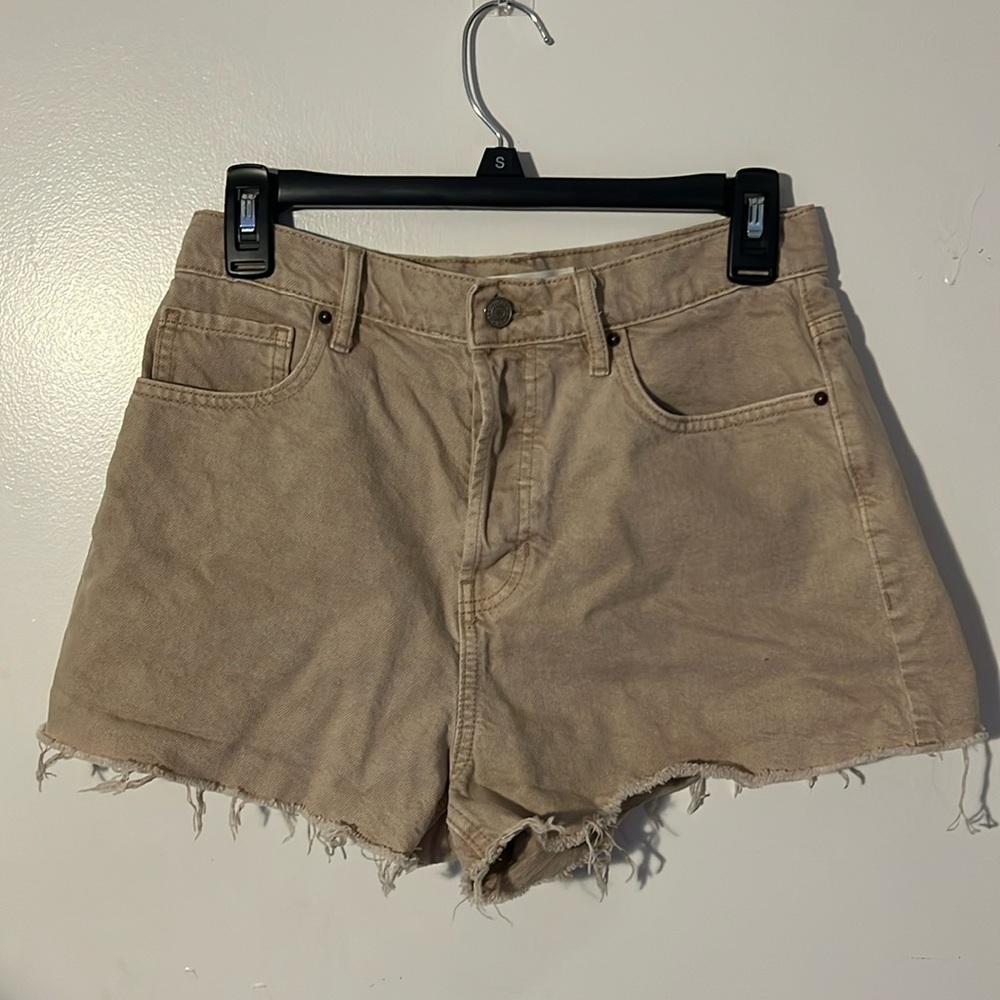 Tan distressed high rise pacsun shorts.